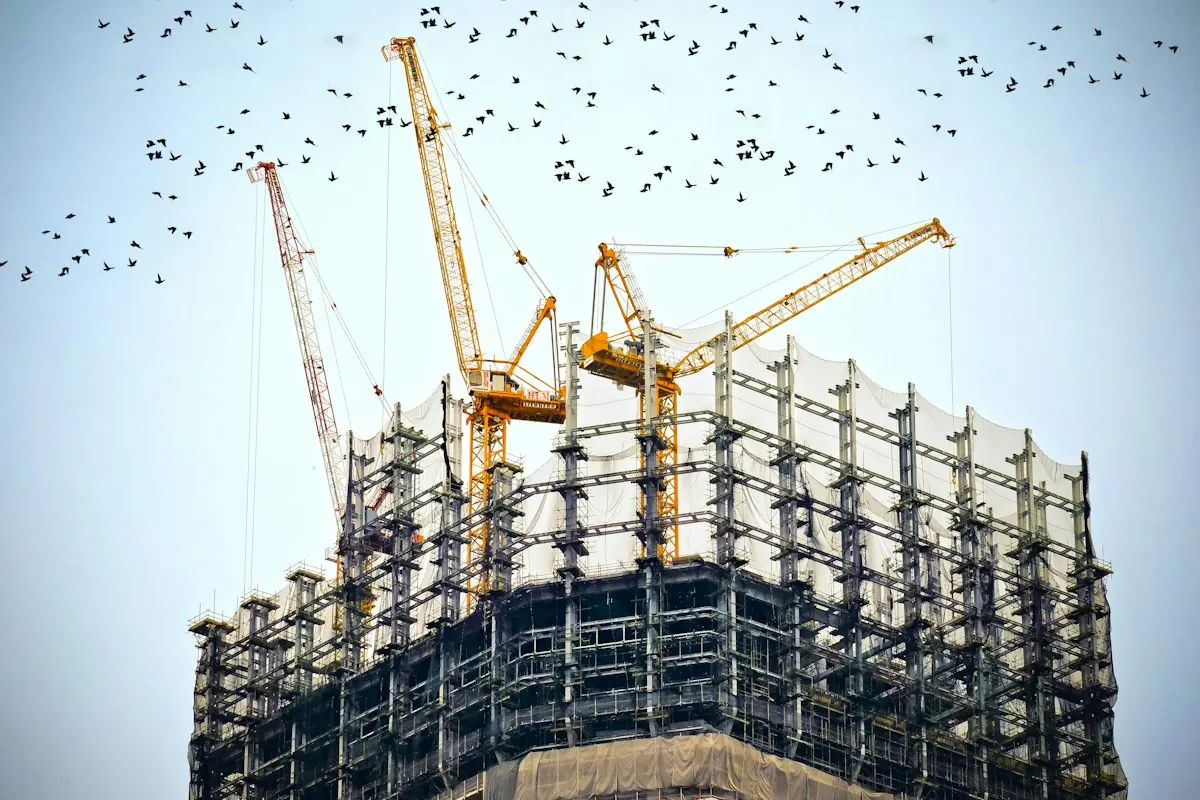 Tower cranes over a building under construction